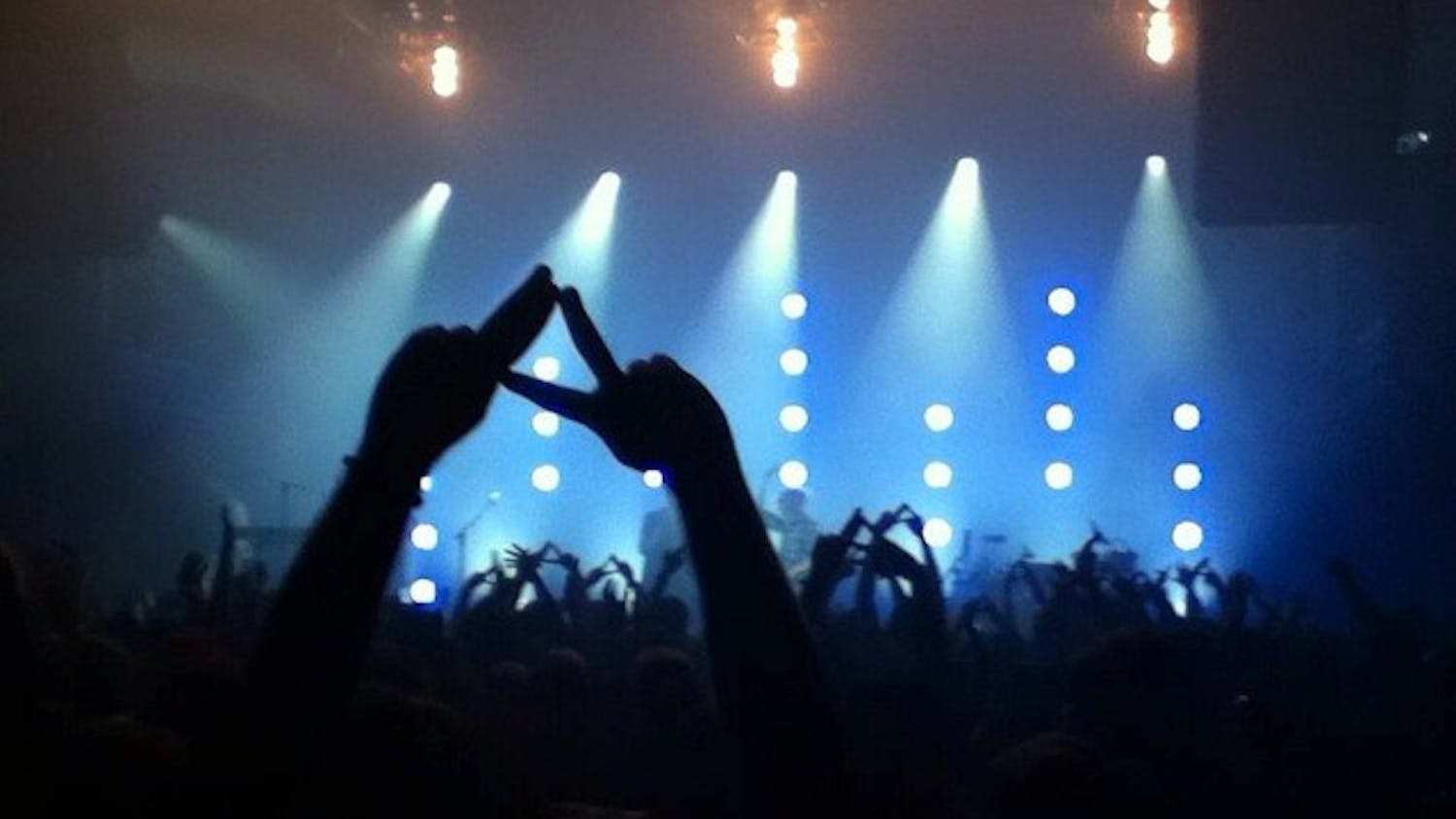 	The crowd at the Alt-J concert held their arms in the air, forming the band&#8217;s signature triangle with their thumbs and index fingers.