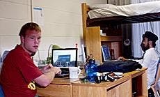 Freshmen Ryan Pickett, left, and Pavneet Singh work in their cramped triple on the fifth floor of Letts Hall.