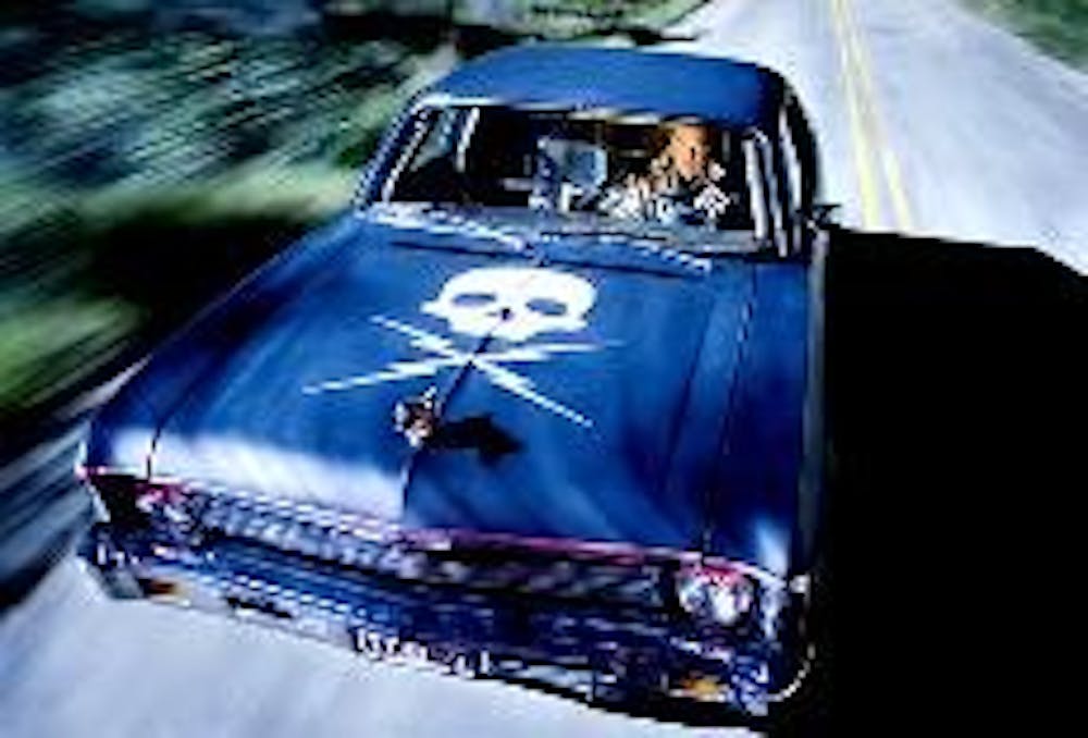 Kurt Russell plays a psycho killer chasing Rosario Dawson in "Death Proof," the second-half of this double feature film.  