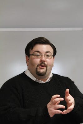 Senator for the Class of 2010 Steve Dalton defends the budget proposed by the committee he chaired at the Undergraduate Senate meeting Sunday.