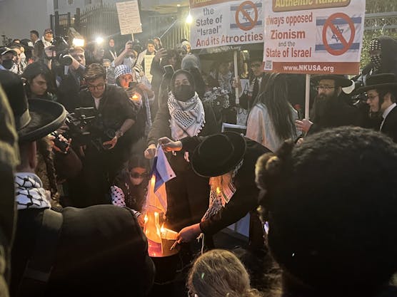 israel embassy protest flag burning pic 