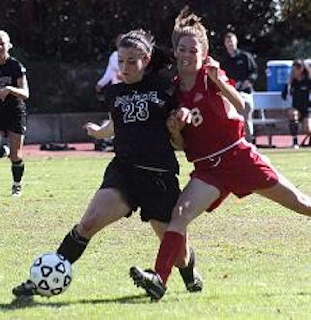 No. 8 Katelynn Donovan fights Colgate's Jackie Burch for the ball in the Eagles' loss to the Raiders on Saturday at home. 