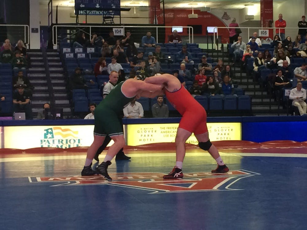 Redshirt senior heavyweight Brett Dempsey locks up in his final match at Bender Arena.