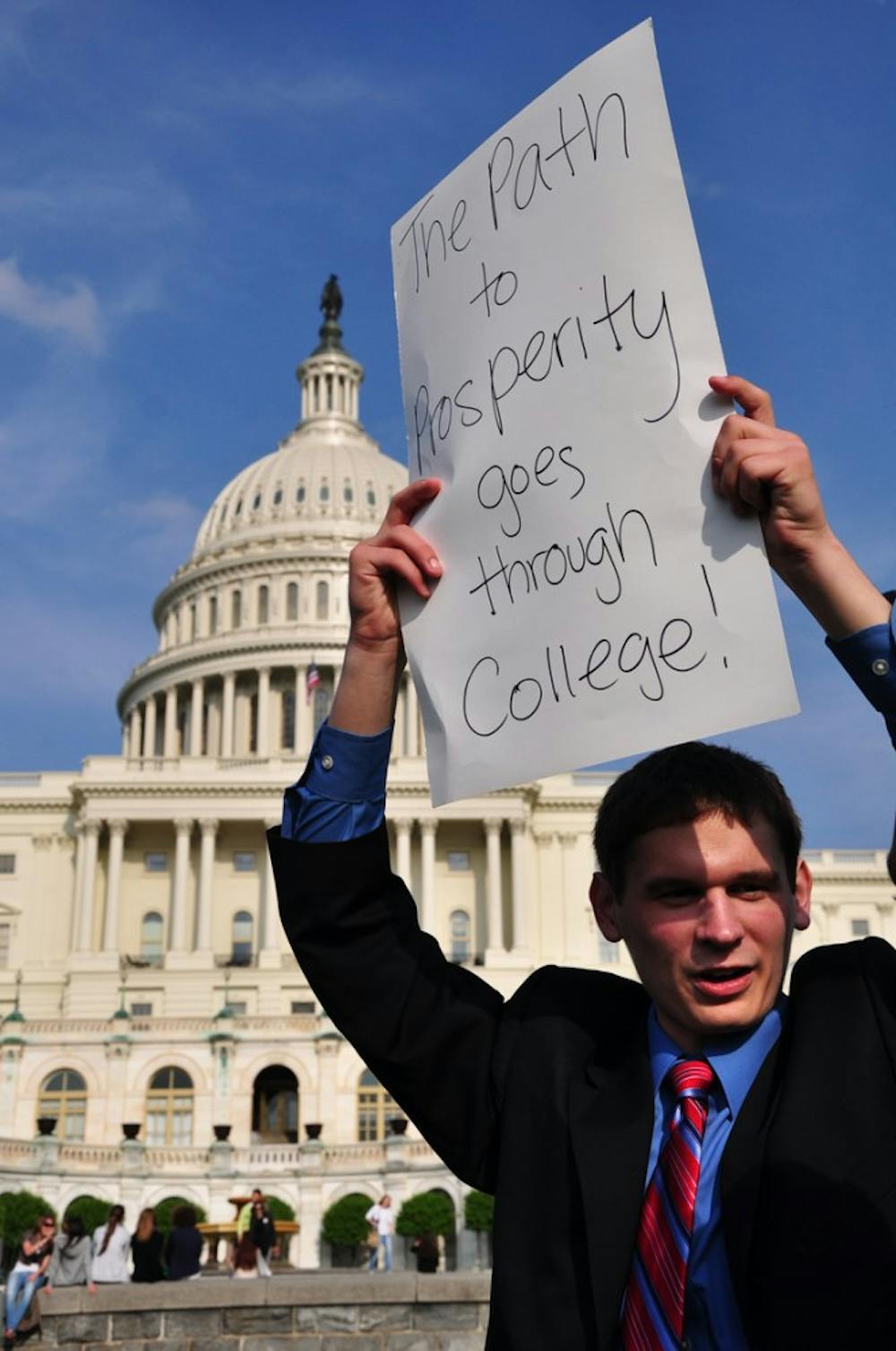 Freshman Tyler Sadonis protests the cuts to student aid at the Capitol on Friday.