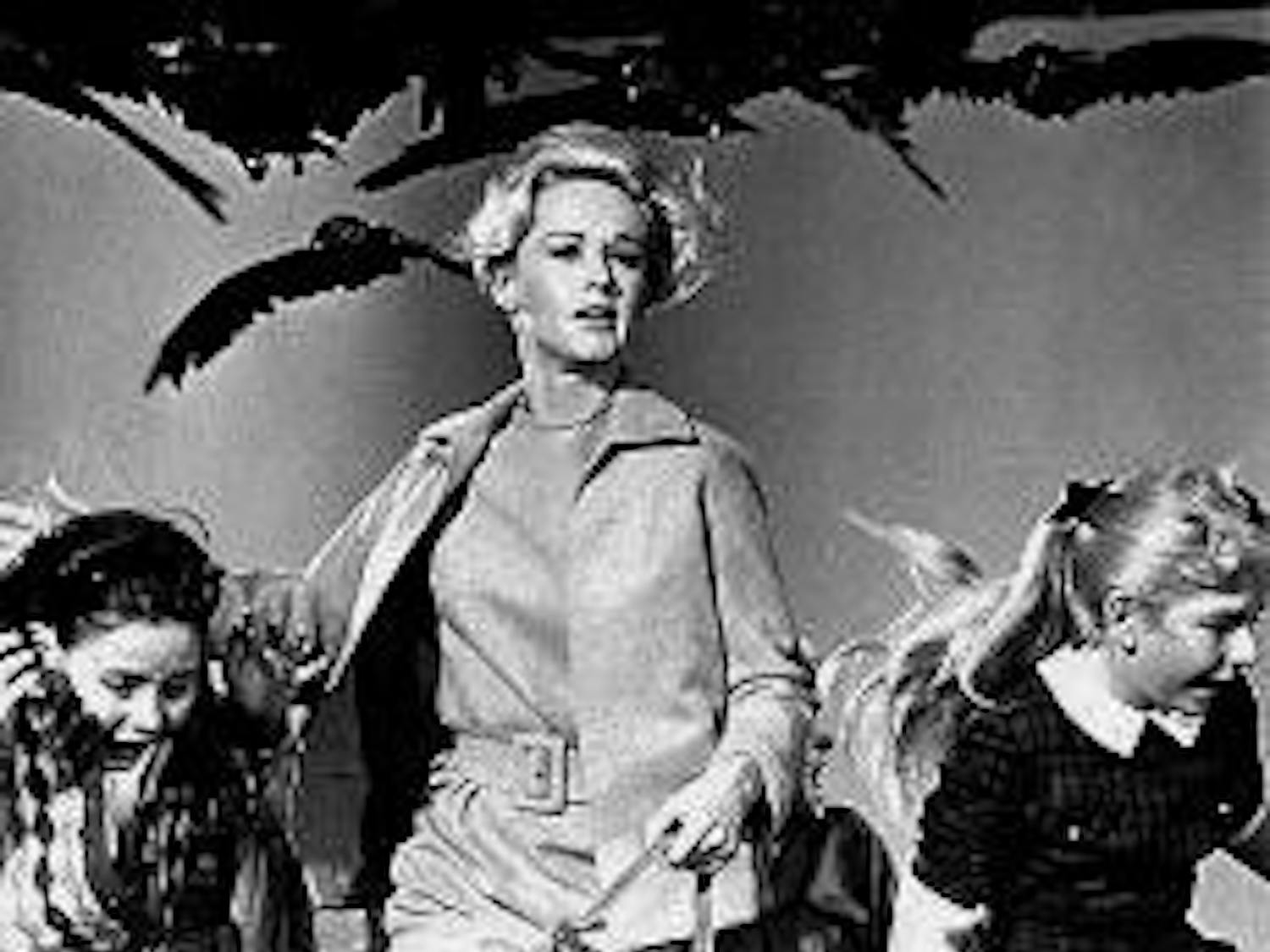 The graceful Tippi Hedren battles violent birds in Hitchcock's 1963 horror film.