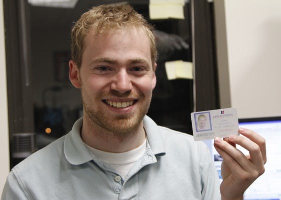 HEY, CHECK THIS OUT! â€” SG President Andy MacCracken has worked tirelessly this year to introduce combination AUID-SmarTrip cards for students. A test program was recently expanded from 20 IDs to 300. Above, MacCracken shows off his own hybrid-card.