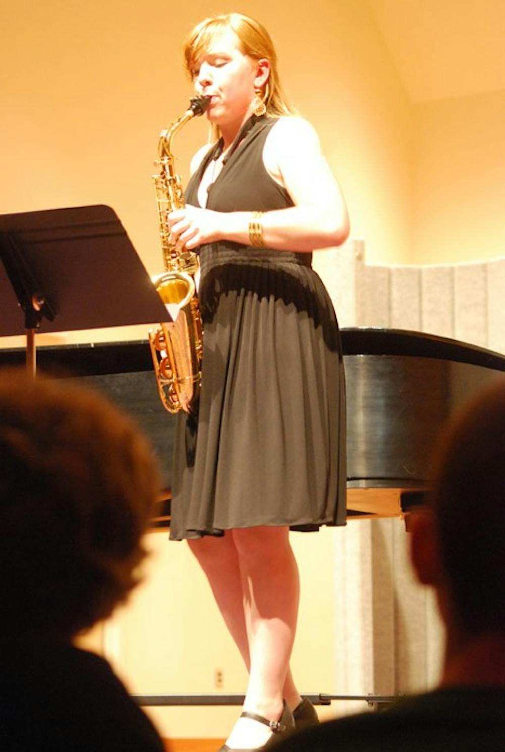 The AU community attended a concert celebrating the Spanish and Latin American music on Friday. The concert featured AU music students like Emily Warden, â€˜11 CAS (pictured). â€œSienteloâ€ in Spanish means â€œfeel it.â€