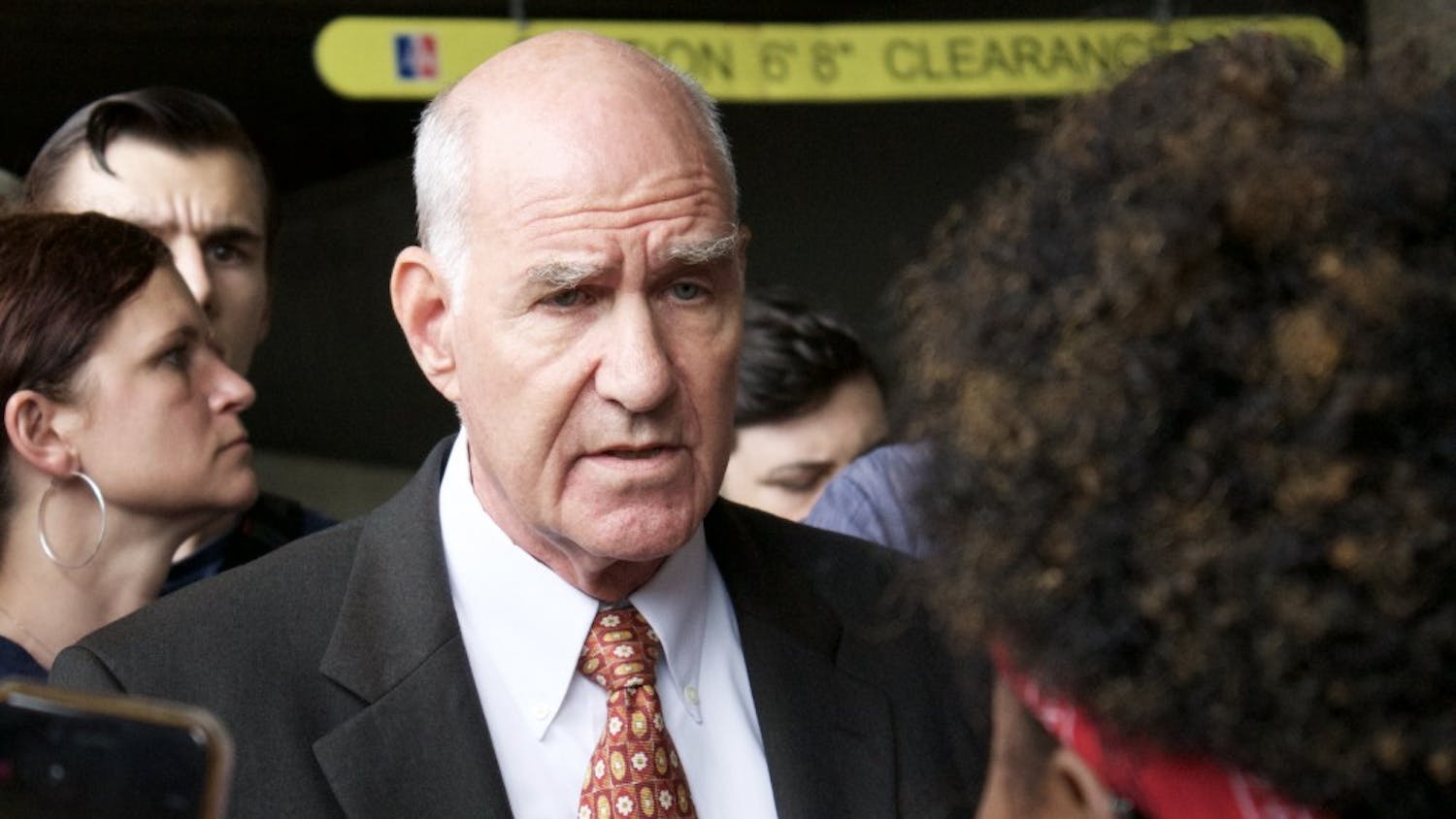 Provost Scott Bass speaks to protesters about their demands at a protest on Friday. 