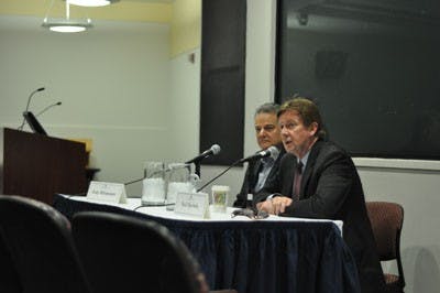 STATE OF THE UNIVERSITY â€” President Neil Kerwin, right, answers a studentâ€™s question at Mondayâ€™s town hall-style event sponsored by the Board of Trustees. Board Chairman Gary Abramson sits to Kerwinâ€™s right.