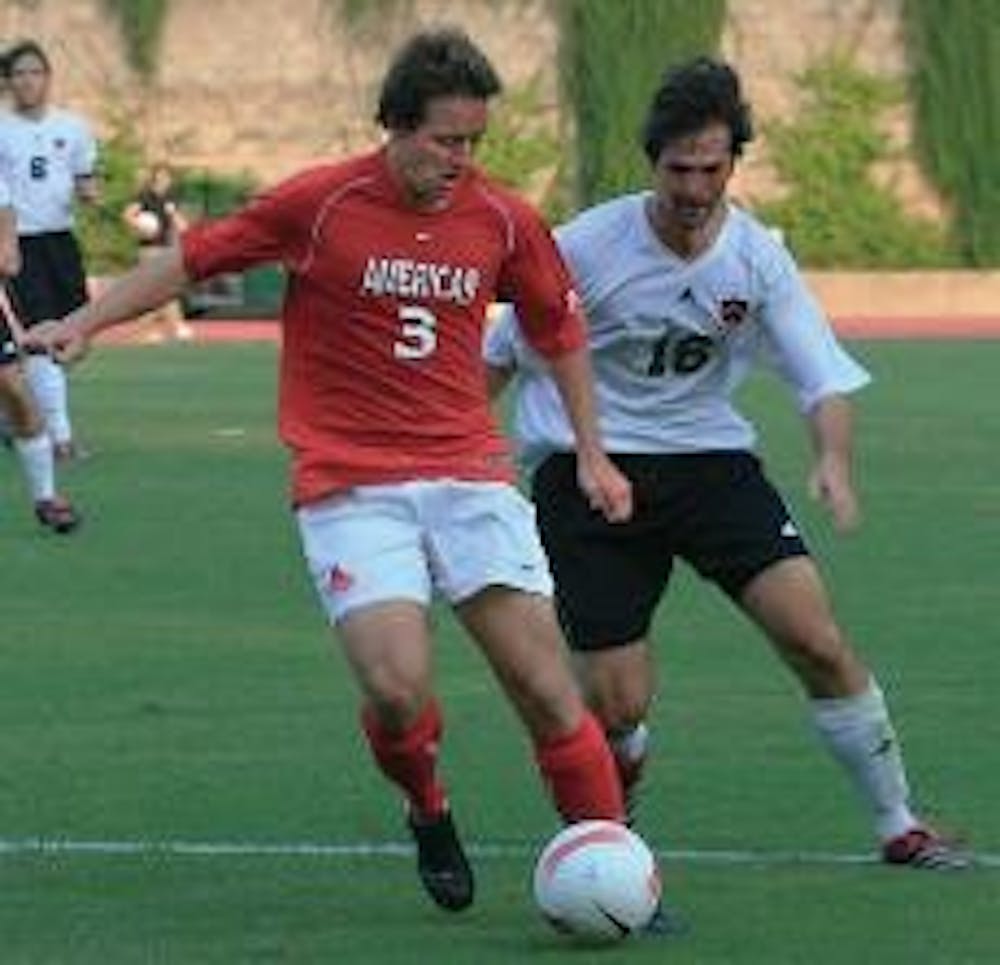 HOME OPENER- Sophomore Cameron Petty defends against Robbie Morgenroth of the Princeton Tigers. It was the first game of the season played on home turf. AU Eagles won the game 2-0.