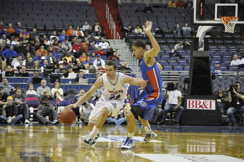 Steve Luptak dribbles past a defender in the menâ€™s 67-48 loss to the University of Florida Gators Sunday.