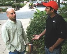 David Roderiguez, left, and Arjun Singh, graduate students in Kogod, smoking outside the library yesterday.