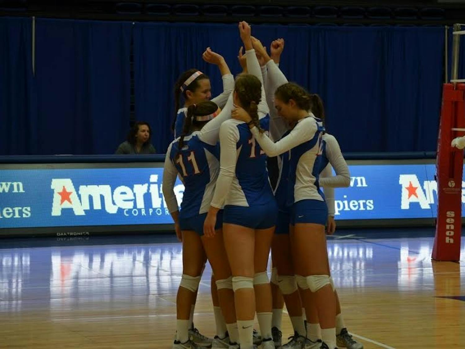 AU volleyball celebrates during a match in September.