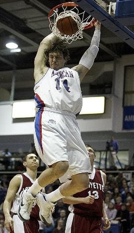 CROWD PLEASER - Senior forward Brian Gilmore brought the crowd to its feet with this monster dunk last night against Lafayette. (above) Senior guard Garrison Carr scooped a layup  (below) in the Eagles' 78-54 win. 