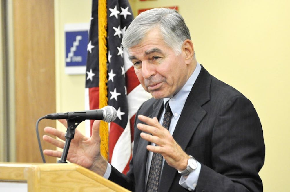 Former Massachusetts Governor Michael Dukakis speaks to a crowd at the University Club Wednesday afternoon.