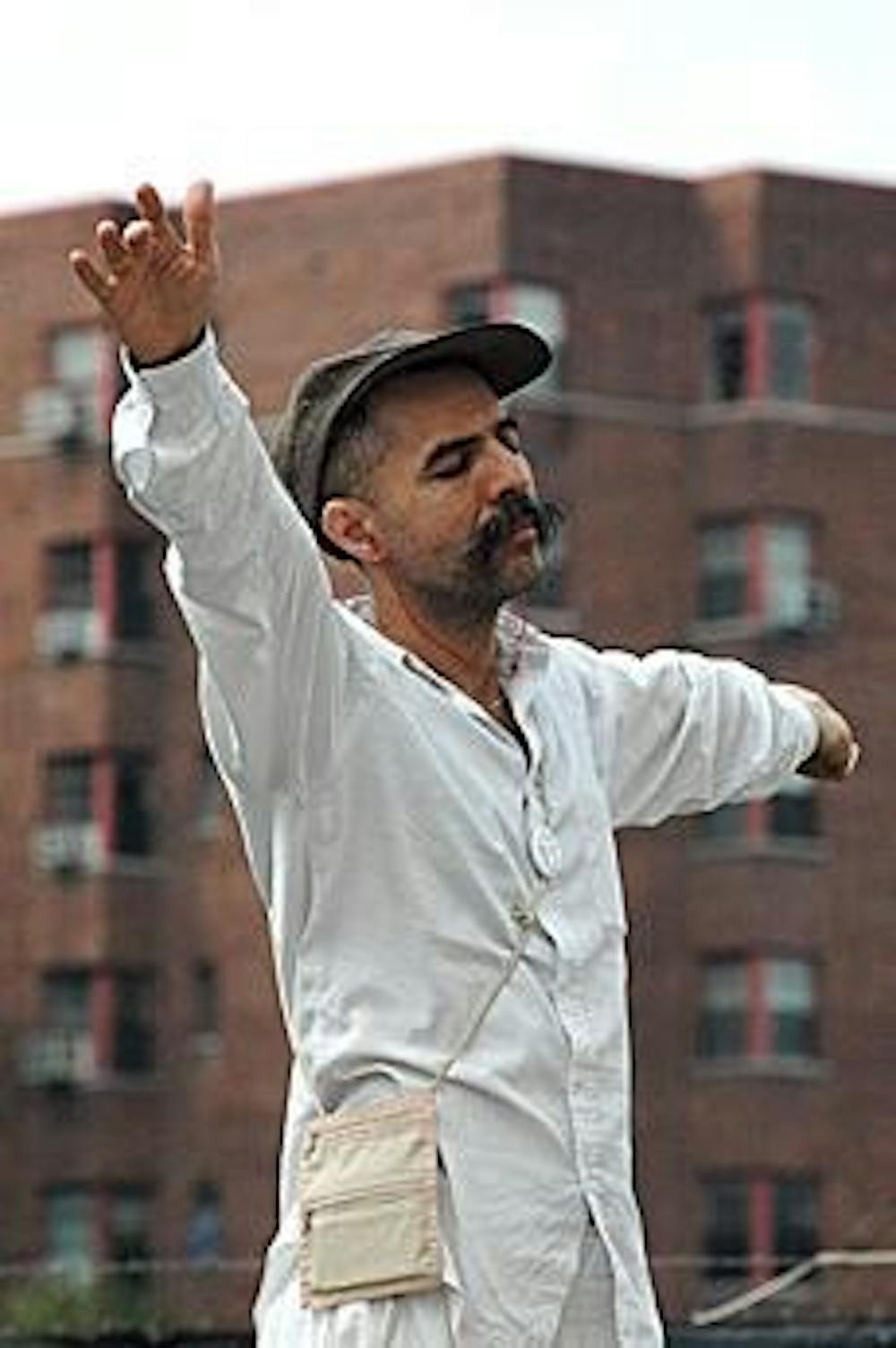 Gabriel Sufi of Virginia prays during the Unity Walk yesterday. 