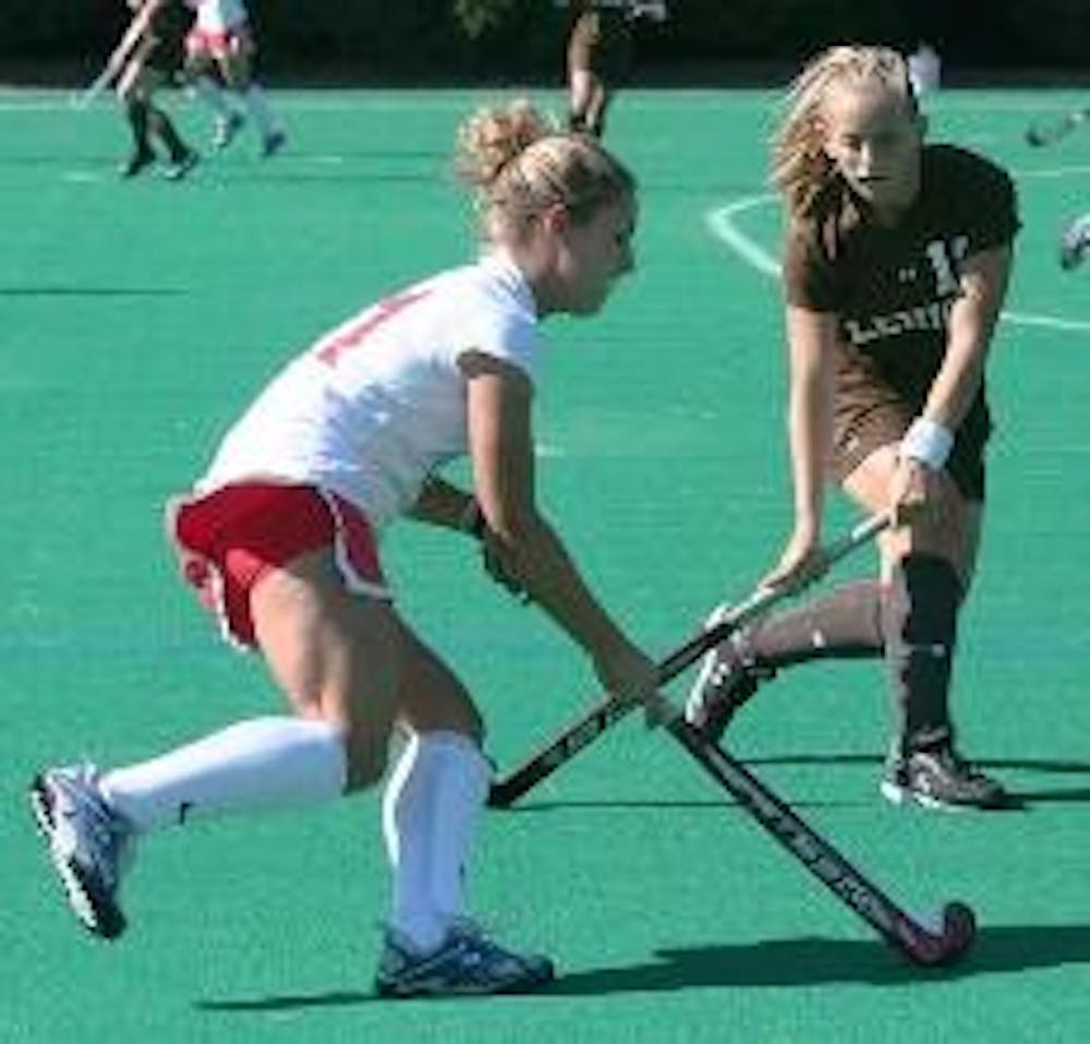 DETERMINED DRIBBLE - Junior attacker Jesika Pufnock dribbles the ball down the field, trying to keep it away from her Lehigh opponent. The Eagles defeated their opponent 6-1 in the Senior Day celebration game. 