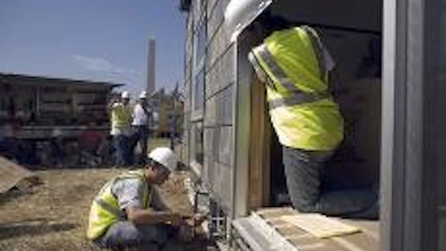 ENERGY EFFICIENT - Students from Penn State work on completing their house for the third annual Solar Decathlon on the National Mall Oct. 4. The entry, called MorningStar, is an 800-square-foot home powered by solar energy. The competition was held from O