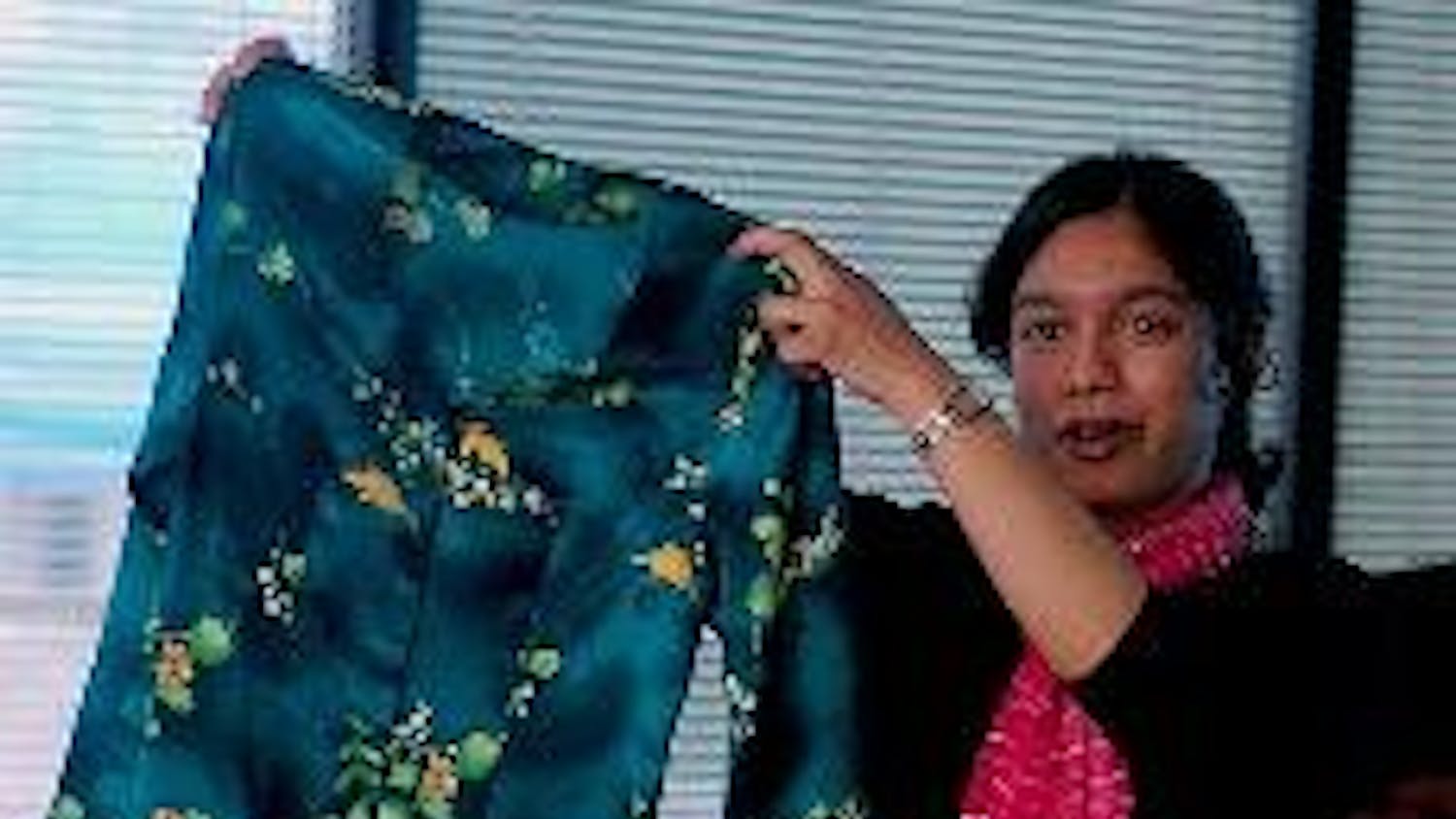 Anisa Ismail presents Malaysian clothes at an international forum.