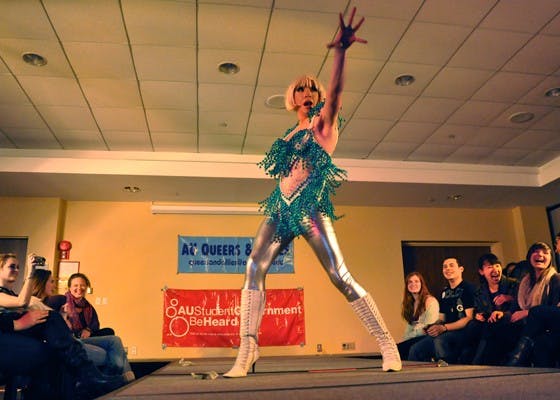 STRIKE A POSE â€” The glittering Athena Ducockis struts her stuff on the catwalk at the annual drag show, which took place on Monday night in the University Club. The AU Student Government and Queers and Allies put on the show to raise money for HIV healthcare.