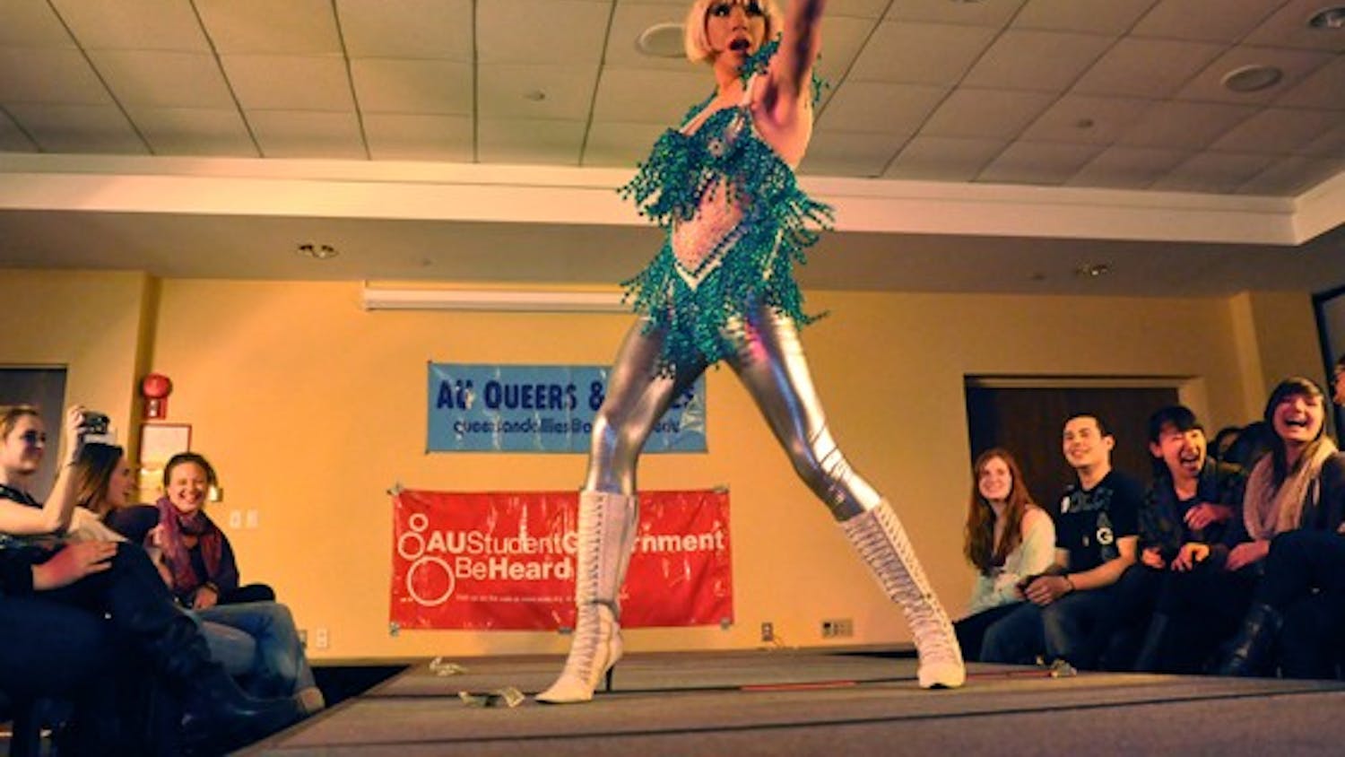 STRIKE A POSE â€” The glittering Athena Ducockis struts her stuff on the catwalk at the annual drag show, which took place on Monday night in the University Club. The AU Student Government and Queers and Allies put on the show to raise money for HIV healthcare.