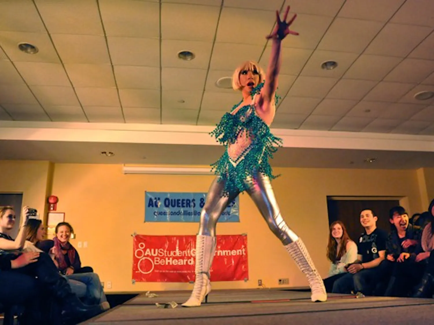 STRIKE A POSE — The glittering Athena Ducockis struts her stuff on the catwalk at the annual drag show, which took place on Monday night in the University Club. The AU Student Government and Queers and Allies put on the show to raise money for HIV healthcare.