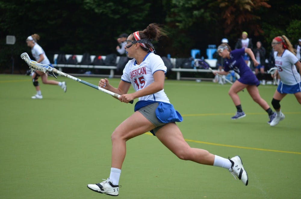 Junior midfielder Lexi Perez carries the ball on offense in the Eagles' 12-10 loss to Holy Cross Saturday at Jacobs Field.
