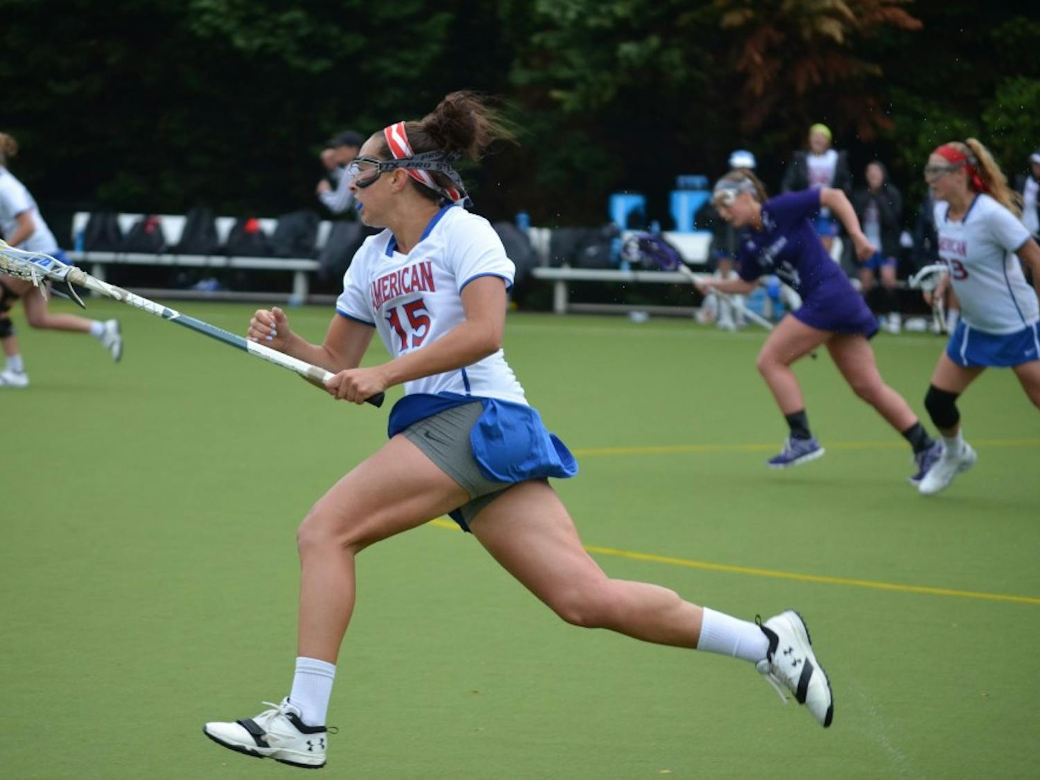 Junior midfielder Lexi Perez carries the ball on offense in the Eagles' 12-10 loss to Holy Cross Saturday at Jacobs Field.