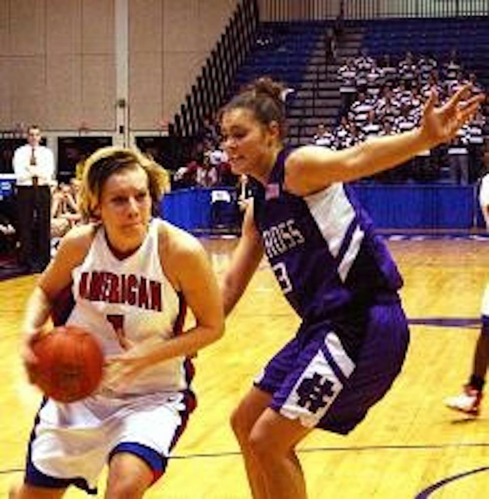 Anna Baran drives to the hoop in the Lady Eagle's game against rival team Holy Cross.