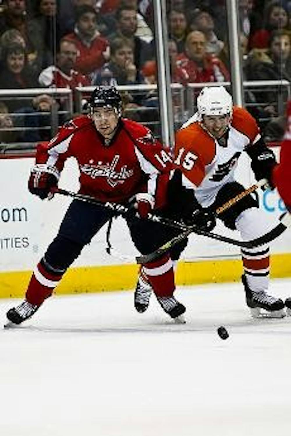 CHASING DOWN A WIN - Washington Capitals forward Tomas Fleischmann races for the puck during a Capitals home game against the Philadelphia Flyers earlier in the season. The Capitals came from behind to beat the Flyers several times this year and hope to d