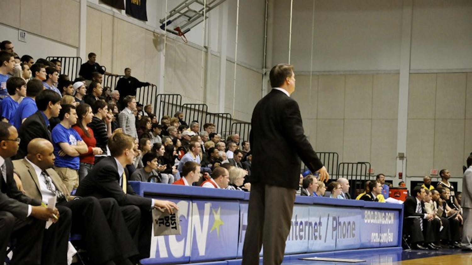 Menâ€™s basketball Head Coach Jeff Jones looks on during Wednesdayâ€™s game. Jones went barefoot while coach to bring attention to the charity, Samaritans Feet.