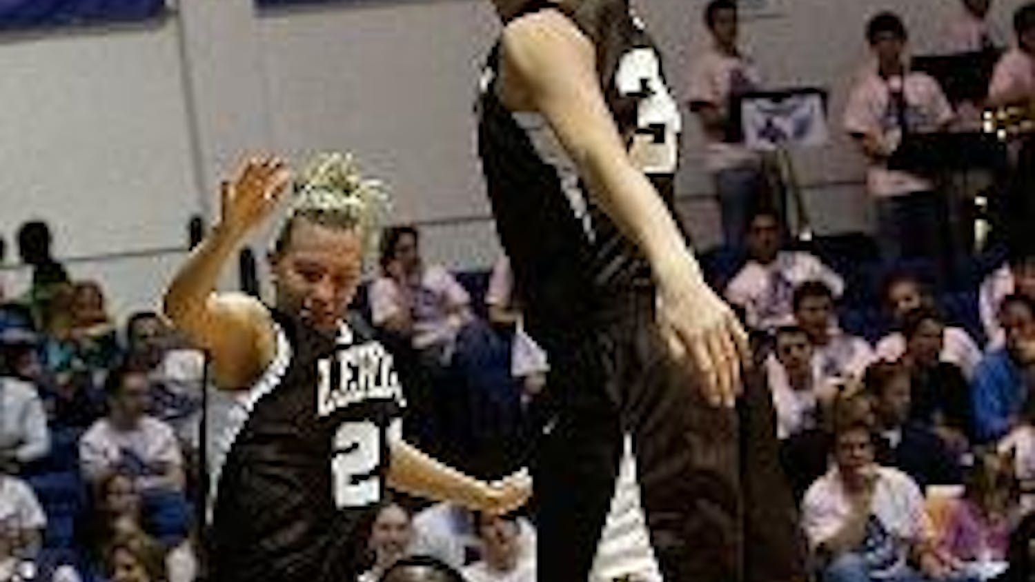 PUMP FAKE -Senior point guard, Pam Stanfield goes up for a shot against two Lehigh players in the Eagles' 65-56 victory over the Mountain Hawks.