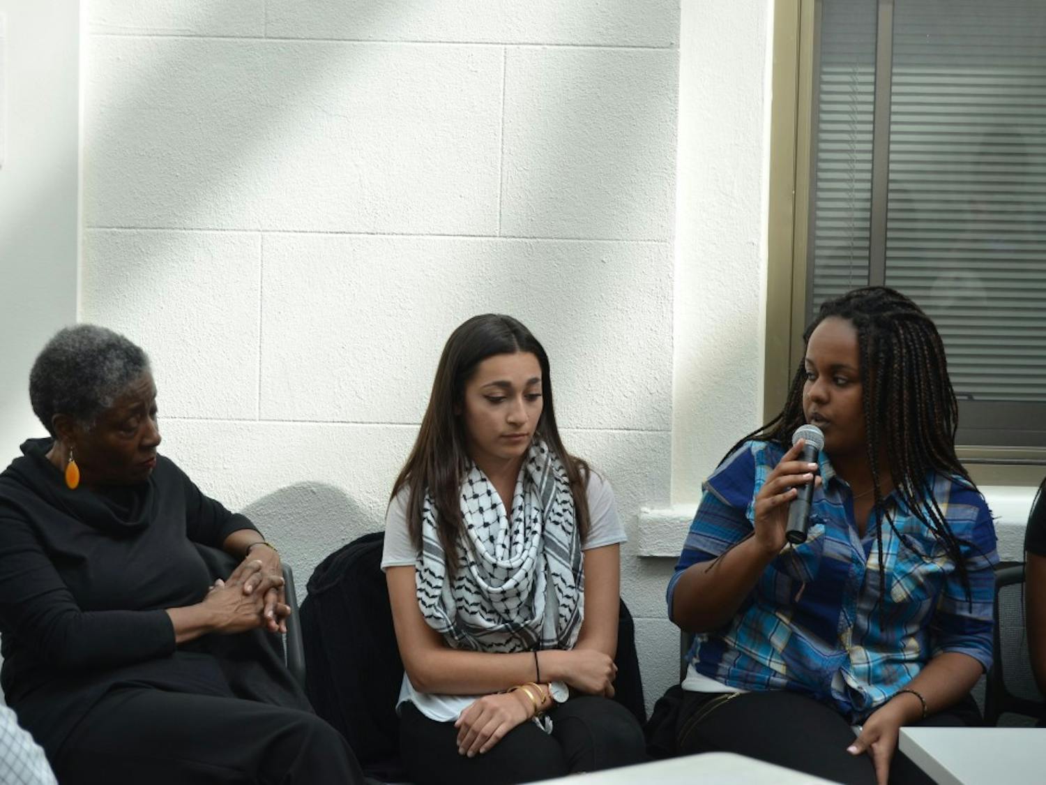 Student activist&nbsp;Helen Abraha, right,&nbsp;speaks during a panel at "Black Lives Matter: A Conversation."&nbsp;