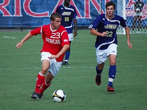Sophomore midfielder David Menzie avoids a James Madison University opponent. Menzie and his Eagle teammates were unable to overcome the Holy Cross Crusaders in the Patriot League semifinals, losing 2-1. 
