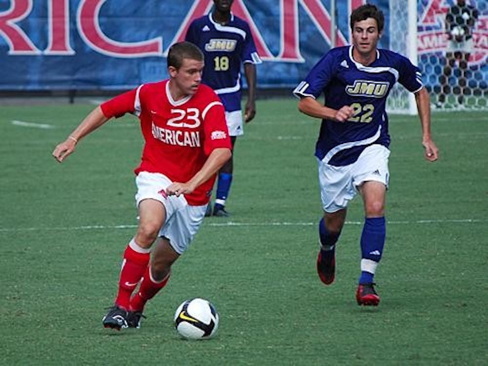 Sophomore midfielder David Menzie avoids a James Madison University opponent. Menzie and his Eagle teammates were unable to overcome the Holy Cross Crusaders in the Patriot League semifinals, losing 2-1. 