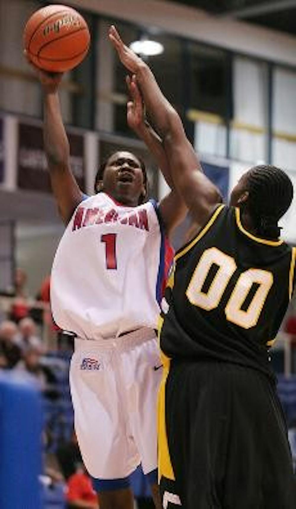 MAKING THE BASKET - Senior forward Stephanie N'Garsanet has her shot blocked by a Virginia Commonwealth University player. The Eagles ended up losing their first home game of the season.