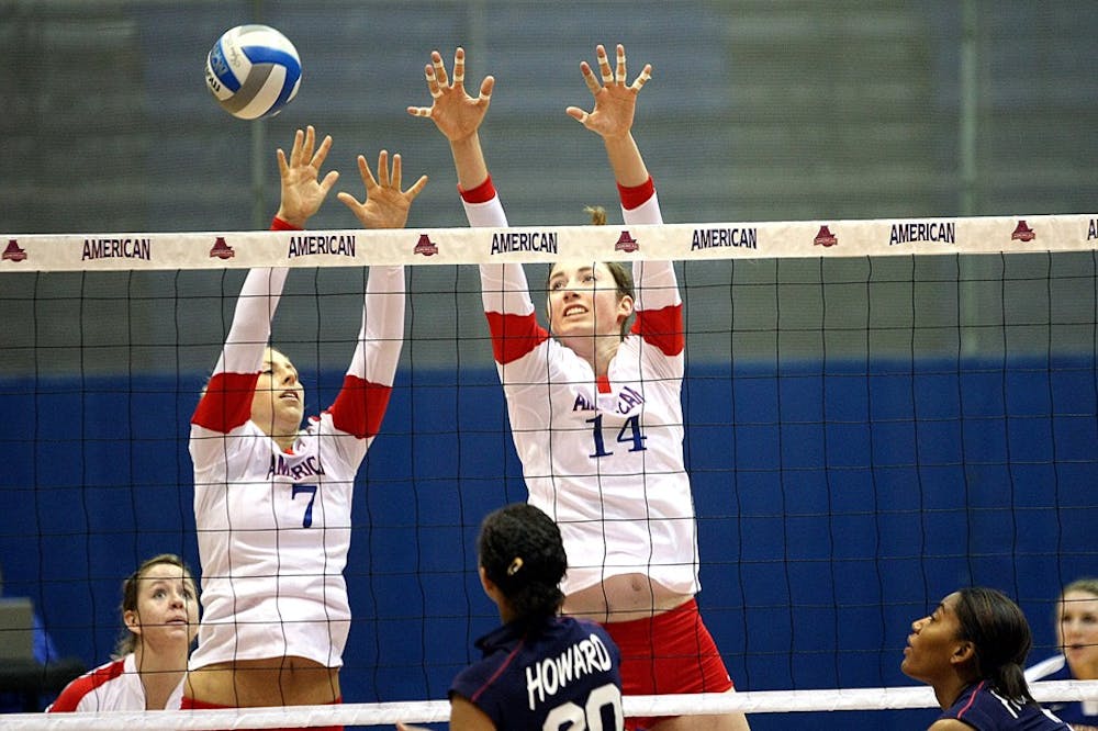 BUMPING IT UP â€” Freshman Krysta Cicala (7) and Senior Claire Recht (14) go up for a block. American improved its record to 3-7 on the season with the victory. They play UNC Sunday.