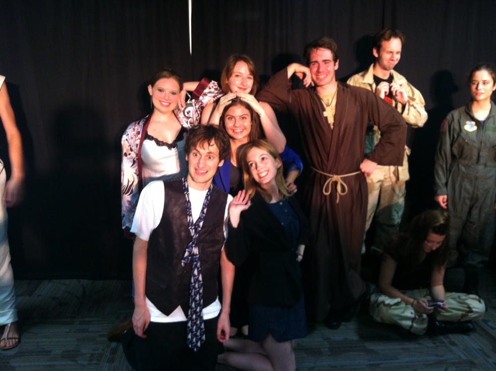 	The cast for the “Measure for Measure” scene poses for a photo during their dress rehearsal. 