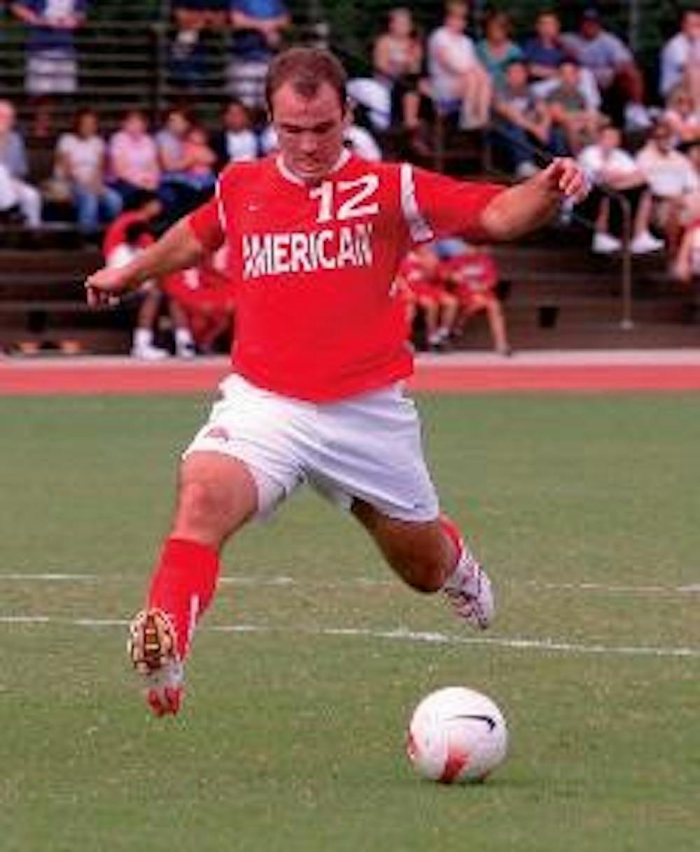 FIGHT FOR THE BALL - (Top) Freshman Daniel Shannon balances on one foot as he approaches the ball and three opponents. (Bottom) Running down the field, junior Philip Purdy remains steady as he heads toward a goal. In a game against the Lafayette Leopards,