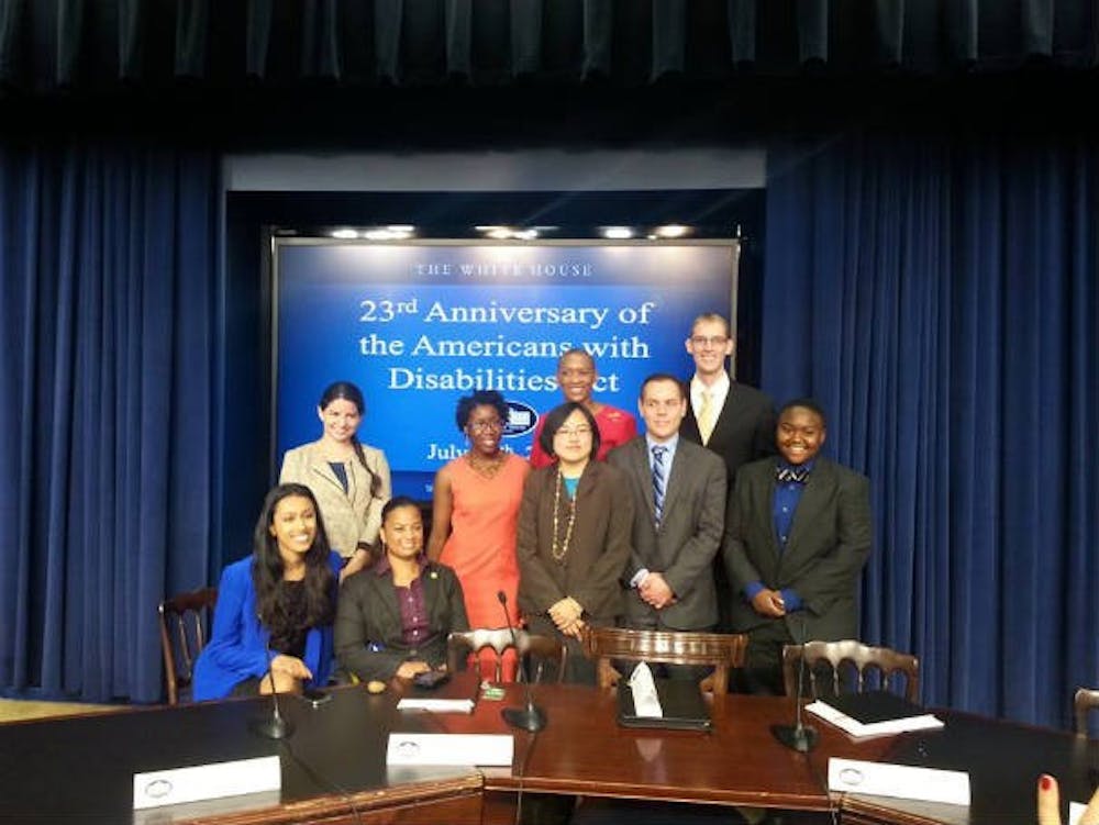 Davidson (right) poses for a picture at the White House after being honored for his work in disability advocacy.