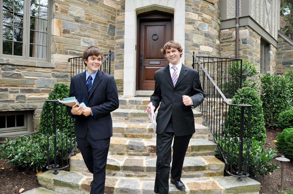 A Voice 4 U Field Director Stephen Bronskill, left, and ANC 3D 02 candidate Tyler Sadonis canvass the neighborhood Sunday afternoon.