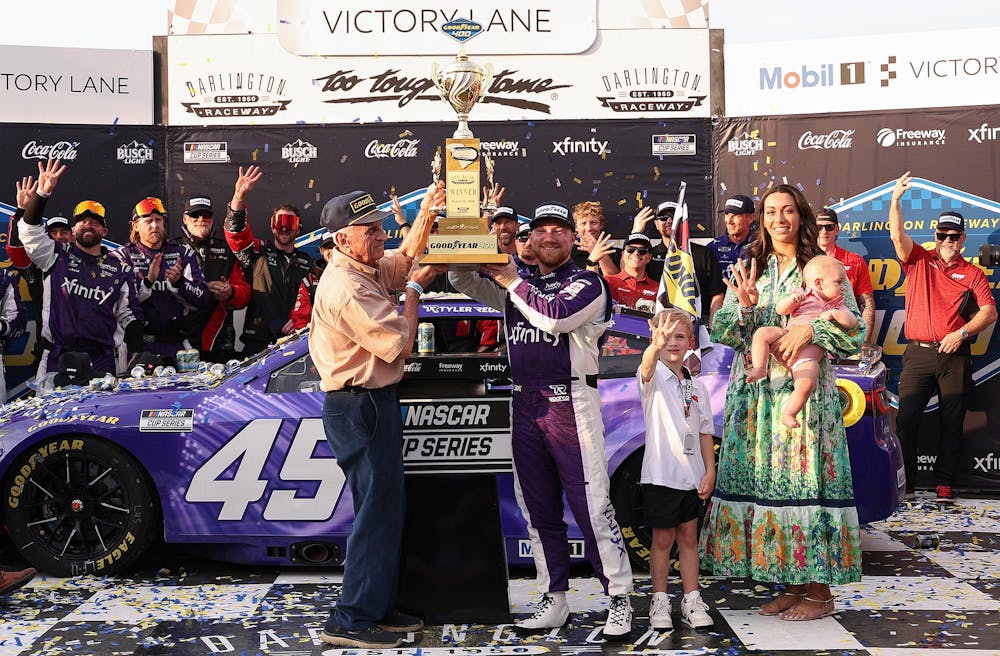 DARLINGTON, SOUTH CAROLINA - MARCH 22: Tyler Reddick, driver of the #45 Xfinity Toyota, celebrates in victory lane after winning the NASCAR Cup Series Goodyear 400 at Darlington Raceway on March 22, 2026 in Darlington, South Carolina. (Photo by David Jensen/Getty Images)