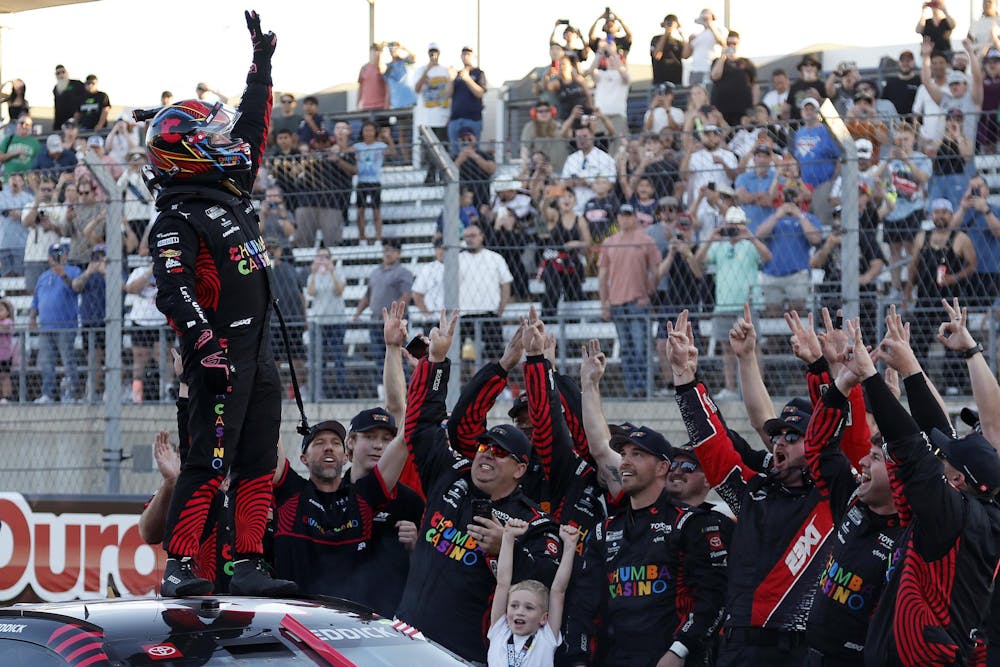 AUSTIN, TEXAS - MARCH 01: Tyler Reddick, driver of the #45 Chumba Casino Toyota, celebrates with his crew and son, Beau Reddick after winning his third race in a row to start the 2026 NASCAR season winning the NASCAR Cup Series DuraMax Grand Prix Powered by RelaDyne at Circuit of The Americas on March 01, 2026 in Austin, Texas. (Photo by Logan Riely/Getty Images)
