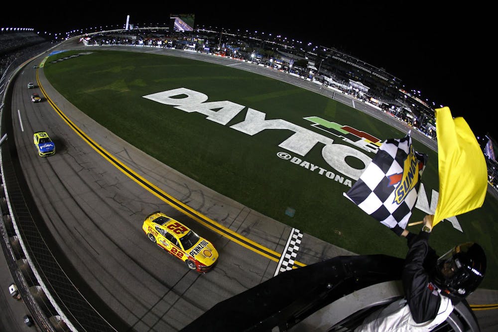 Joey Logano, driver of the #22 Shell Pennzoil Ford, takes the checkered under caution flag to win Duel 1 for the NASCAR Cup Series Daytona 500 at Daytona at Daytona International Speedway on February 12, 2026 in Daytona Beach, Florida.

