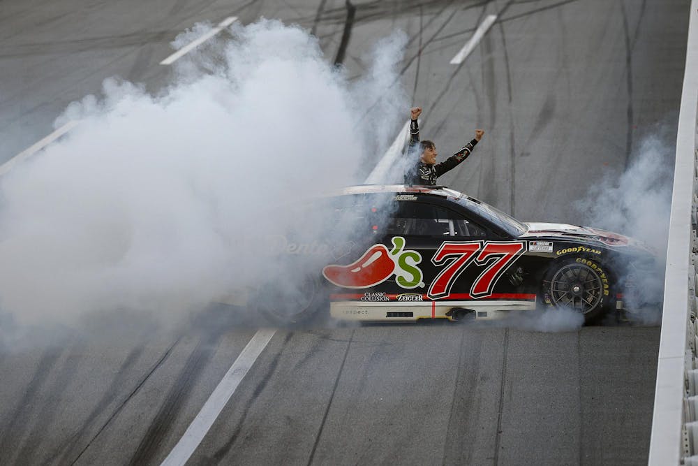 TALLADEGA, ALABAMA - APRIL 26: Carson Hocevar, driver of the #77 Chili's Ride the 'Dente Chevrolet, celebrates after winning the NASCAR Cup Series Jack Link's 500 at Talladega Superspeedway on April 26, 2026 in Talladega, Alabama. (Photo by Sean Gardner/Getty Images)