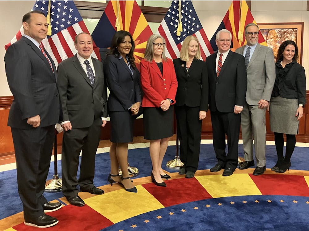 <p>From left to right: Vice Chief Justice John Lopez IV, Justice Clint Bolick, Judge Maria Elena Cruz, Governor Katie Hobbs, Chief Justice Ann Timmer, Justice Bill Montgomery, Justice James Beene, and Justice Kathryn Hackett King.</p>