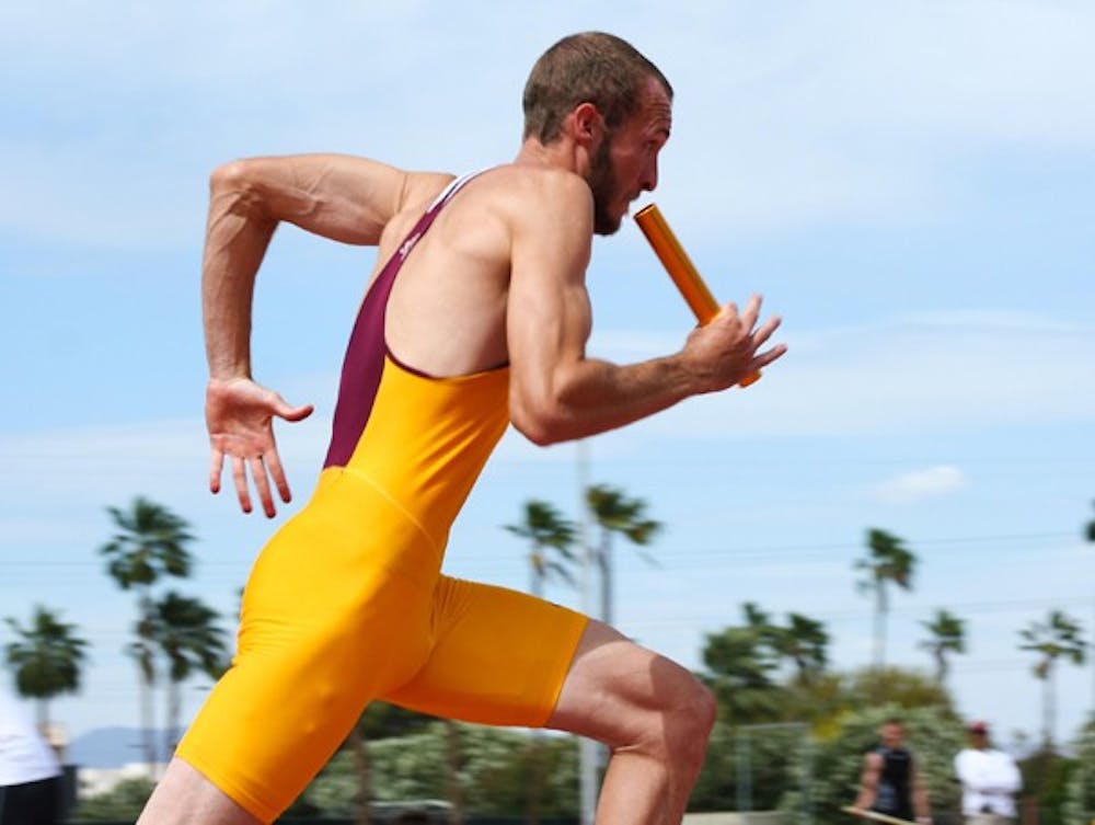 Flying high: ASU junior John Kline runs his leg of the 4x400m relay during the Sun Devil Open on April 23. Both the men’s and women’s track teams upset higher-ranked UA teams at the Double Dual on Saturday. (Photo by Lisa Bartoli)