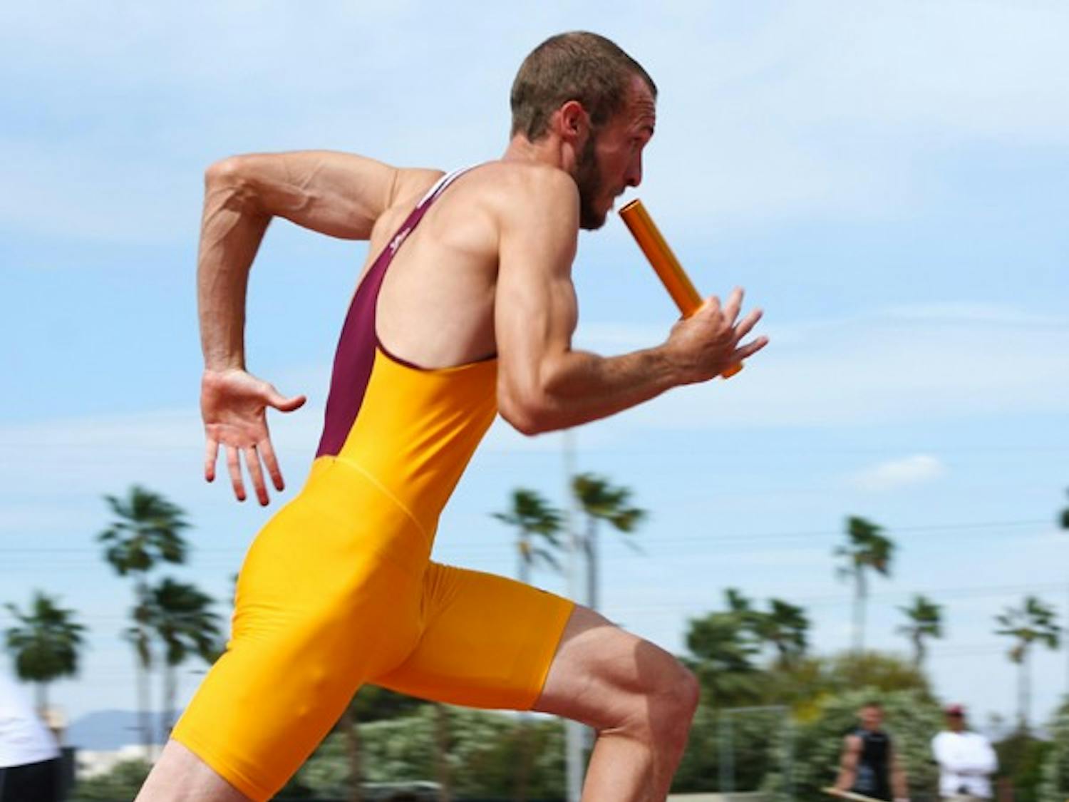 Flying high: ASU junior John Kline runs his leg of the 4x400m relay during the Sun Devil Open on April 23. Both the men’s and women’s track teams upset higher-ranked UA teams at the Double Dual on Saturday. (Photo by Lisa Bartoli)