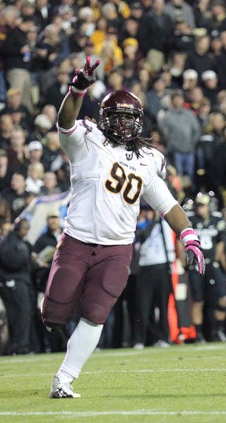 Redshirt junior defensive tackle Will Sutton throws up a pitchfork sign after a play during the Sun Devils’ 51-17 win over Colorado on Thursday. (Photo by Kyle Newman)