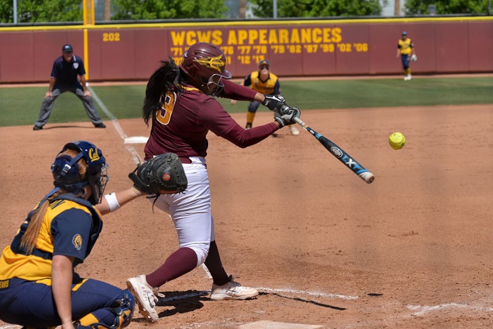 Senior Amber Freeman hits her 50th career home run Sunday afternoon, March 22, 2015, at Farrington Stadium against the California Golden Bears. ASU would go on to win the game and the series. (J. Bauer-Leffler/The State Press)